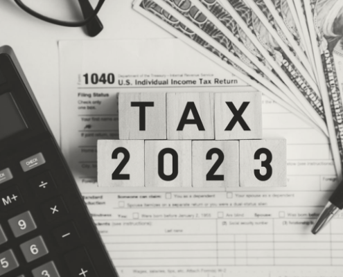 Image with calculator and money for Tax Filing Season 2023