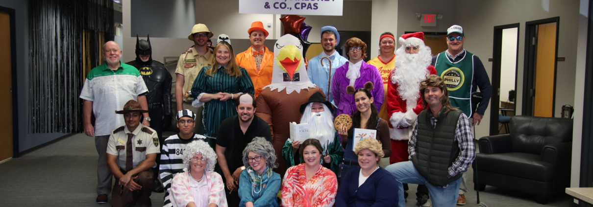 Wouch Maloney employees compete in Halloween costume contest to raise money for the Walk to End Alzheimer's.