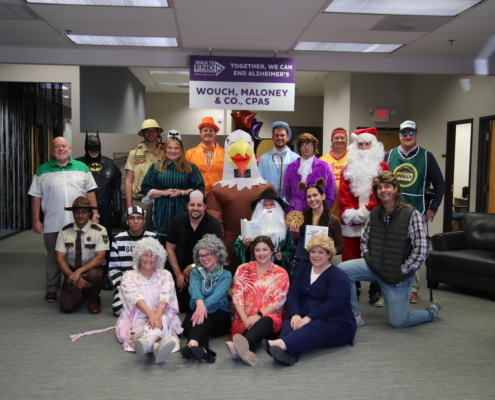 Wouch Maloney employees compete in Halloween costume contest to raise money for the Walk to End Alzheimer's.