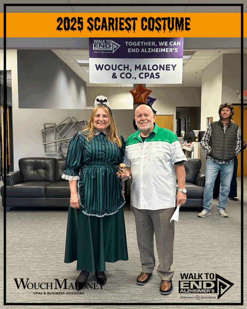Woman dressed as a maid from Disney's Haunted Mansion receiving a trophy.