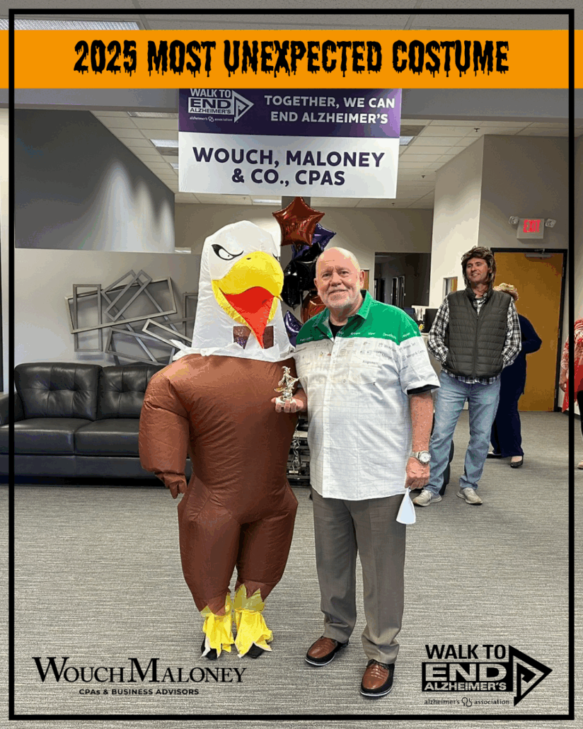 Eagle costume with man presenting a trophy